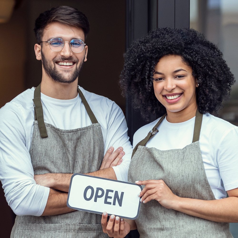 Two business owners with an open sigh